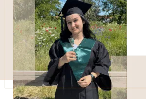 olivia b standing in a grad outfit