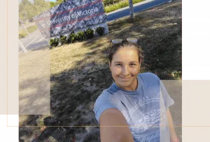 ester standing in front of the University of Victoria sign