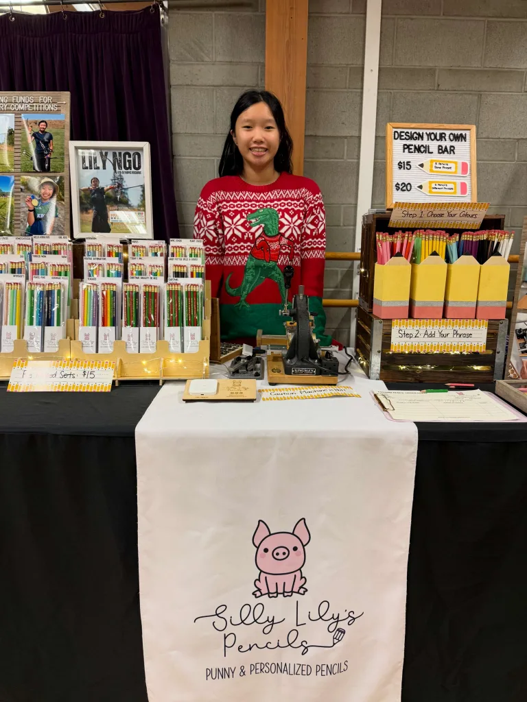 Lily standing at her vendor booth