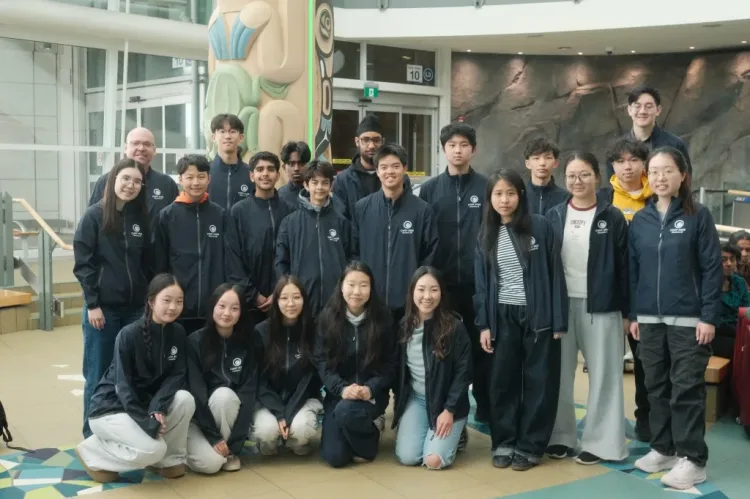a group photo with the people wearing matching jackets
